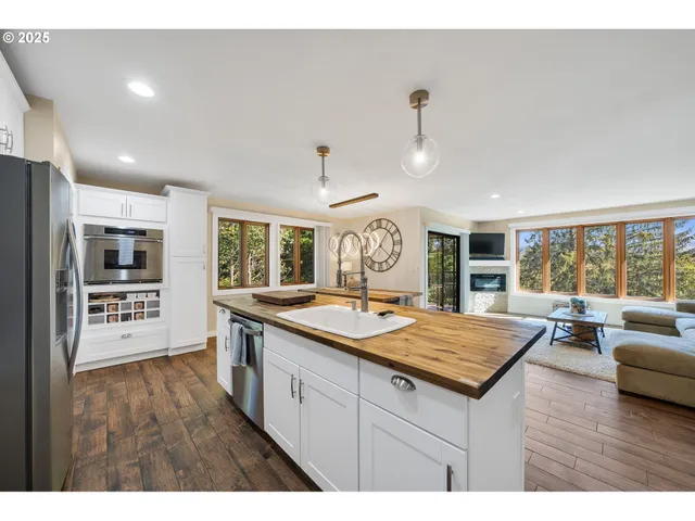 a large kitchen with kitchen island a large counter space appliances and a center island