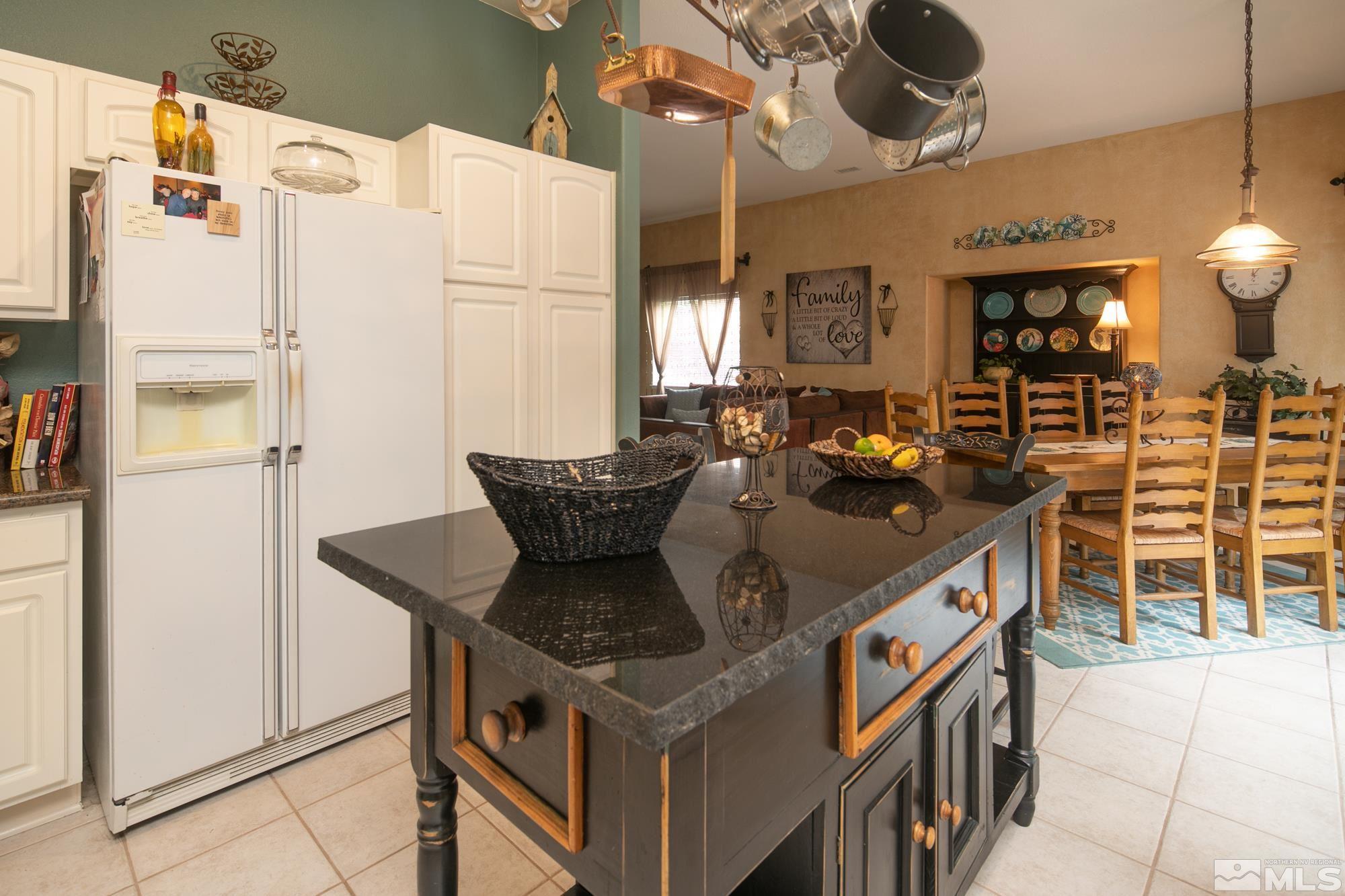 1981 Moon Shadow Drive Reno, NV 89523 - Photo 4 of 26 a kitchen with stainless steel appliances granite countertop a stove and a refrigerator