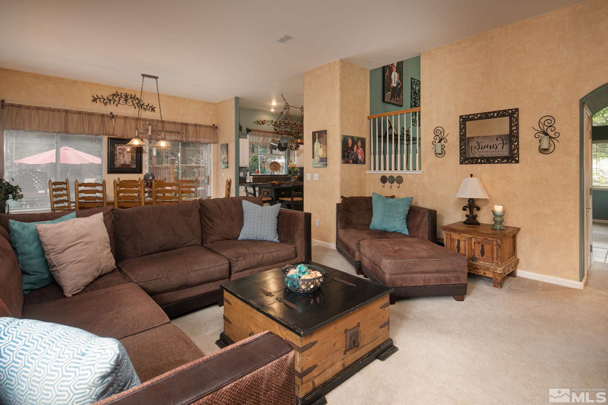 1981 Moon Shadow Drive Reno, NV 89523 - Photo 8 of 26 a living room with furniture and a chandelier