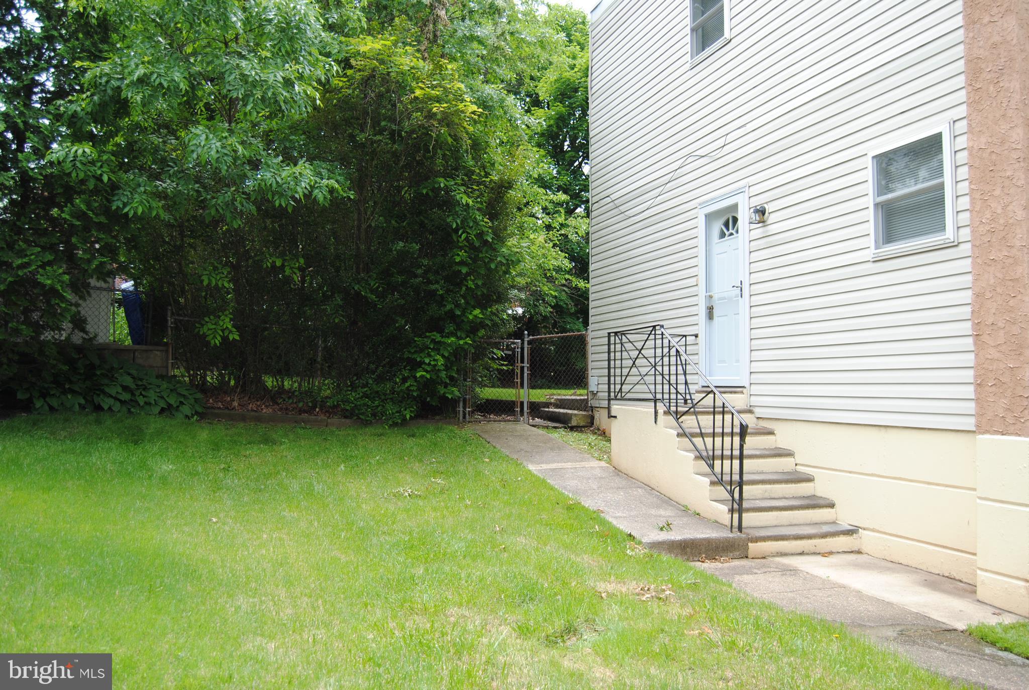 502 Norma Lane Norristown, PA 19401 - Photo 23 of 24 a view of a house with backyard and a garden