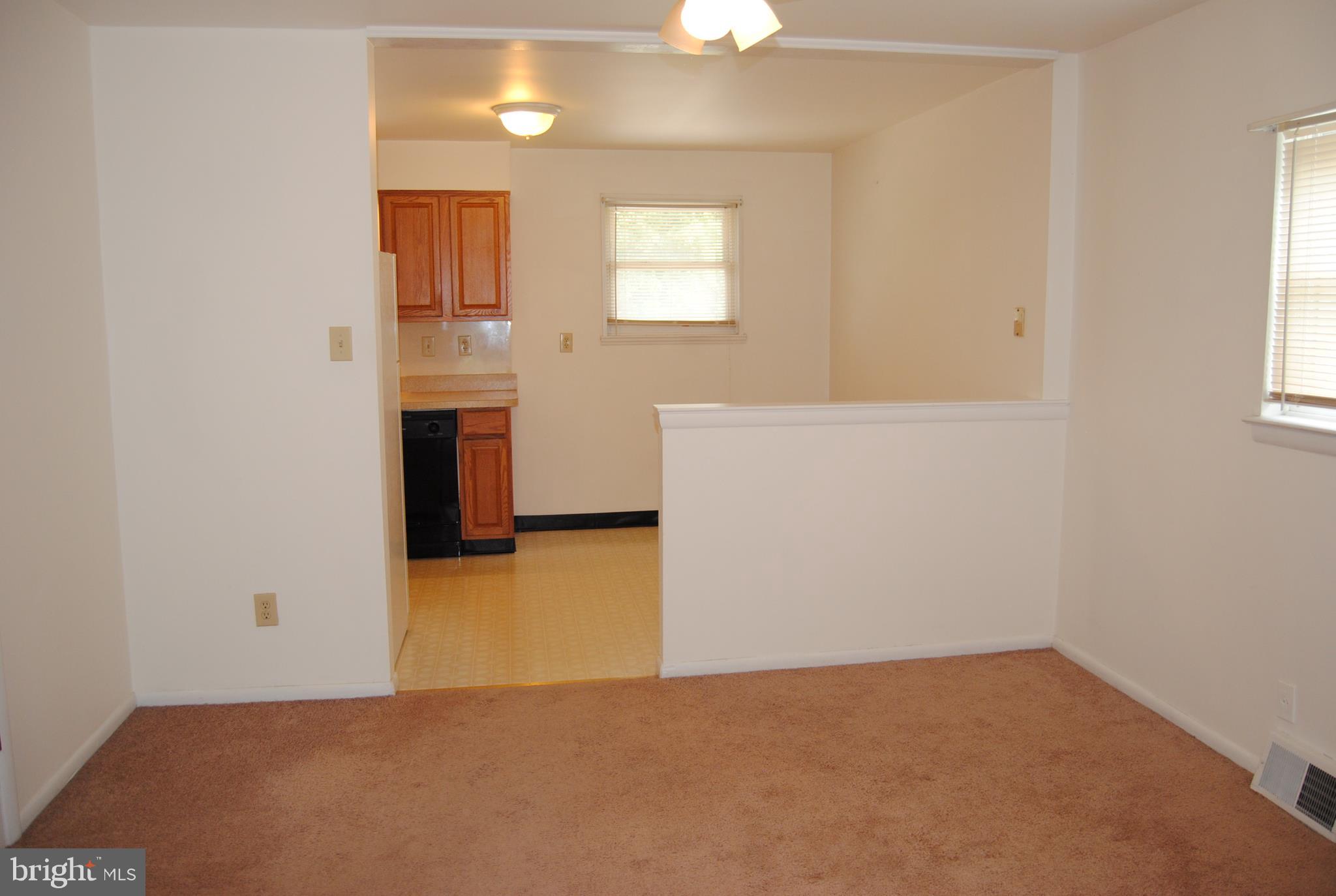 502 Norma Lane Norristown, PA 19401 - Photo 8 of 24 an empty room with windows and cabinet