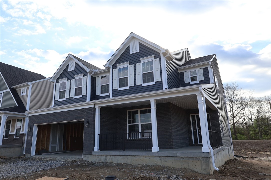 230 Tilly Court, Unit 4 Springboro, OH 45066 - Photo 2 of 20 This newly constructed residence showcases a charming front facade with a welcoming covered porch.