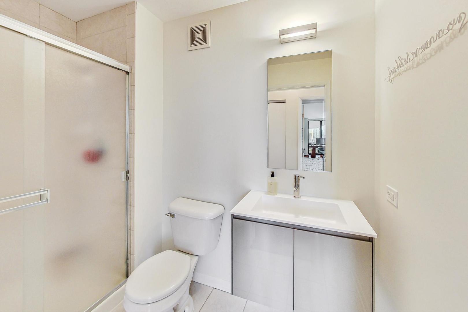 435 West Erie Street, Unit 1501 Chicago, IL 60654 - Photo 17 of 26 a bathroom with a sink toilet and shower