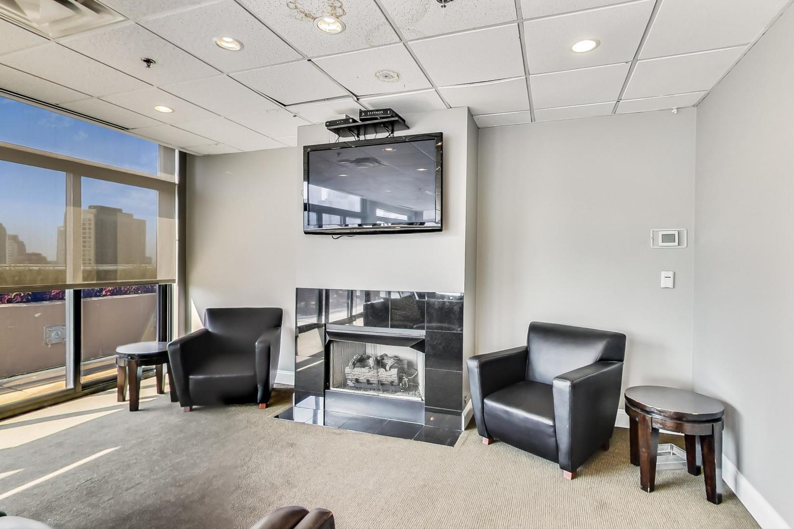 435 West Erie Street, Unit 1501 Chicago, IL 60654 - Photo 21 of 26 a workspace with furniture and a projector