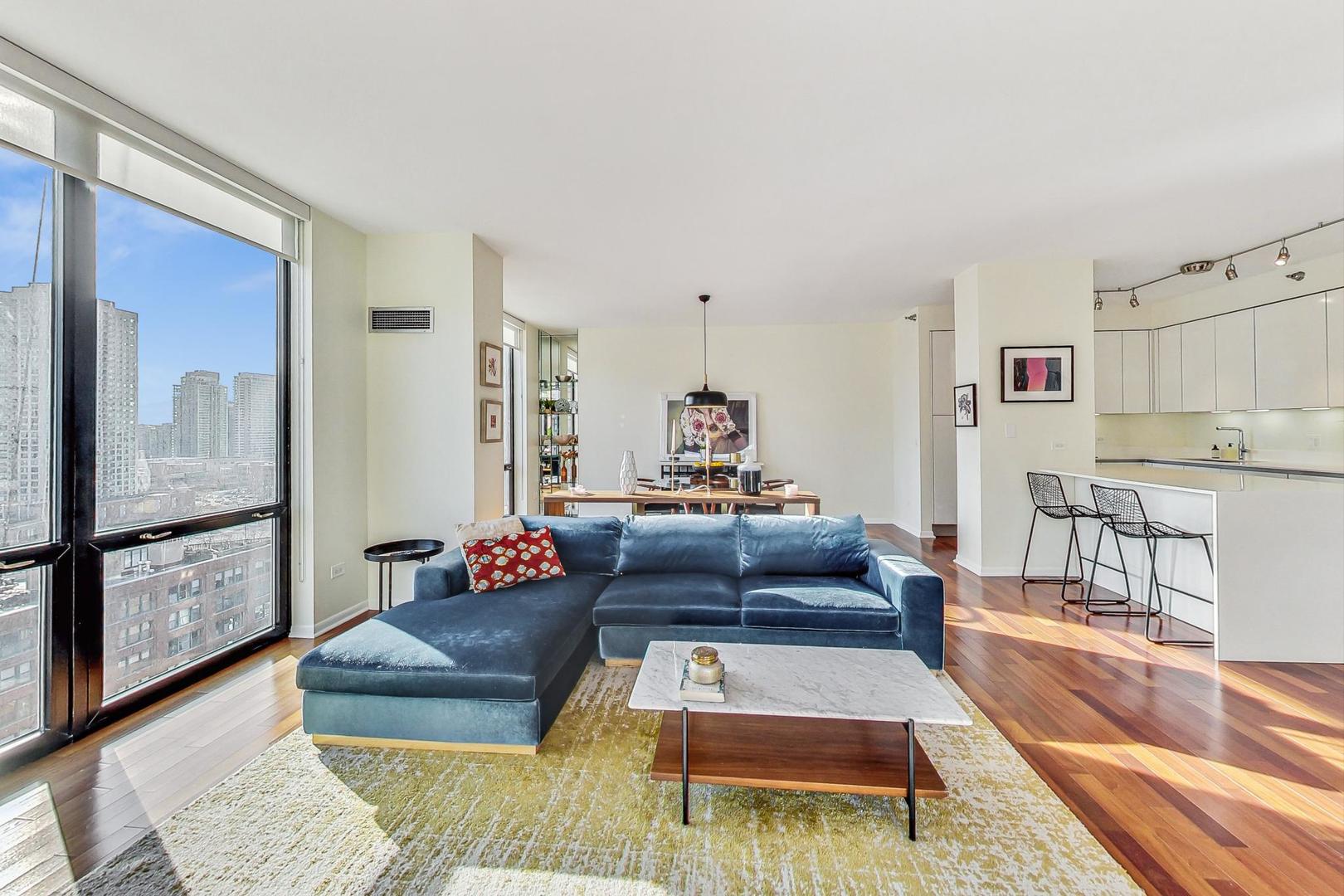 435 West Erie Street, Unit 1501 Chicago, IL 60654 - Photo 5 of 26 a living room with furniture and a large window