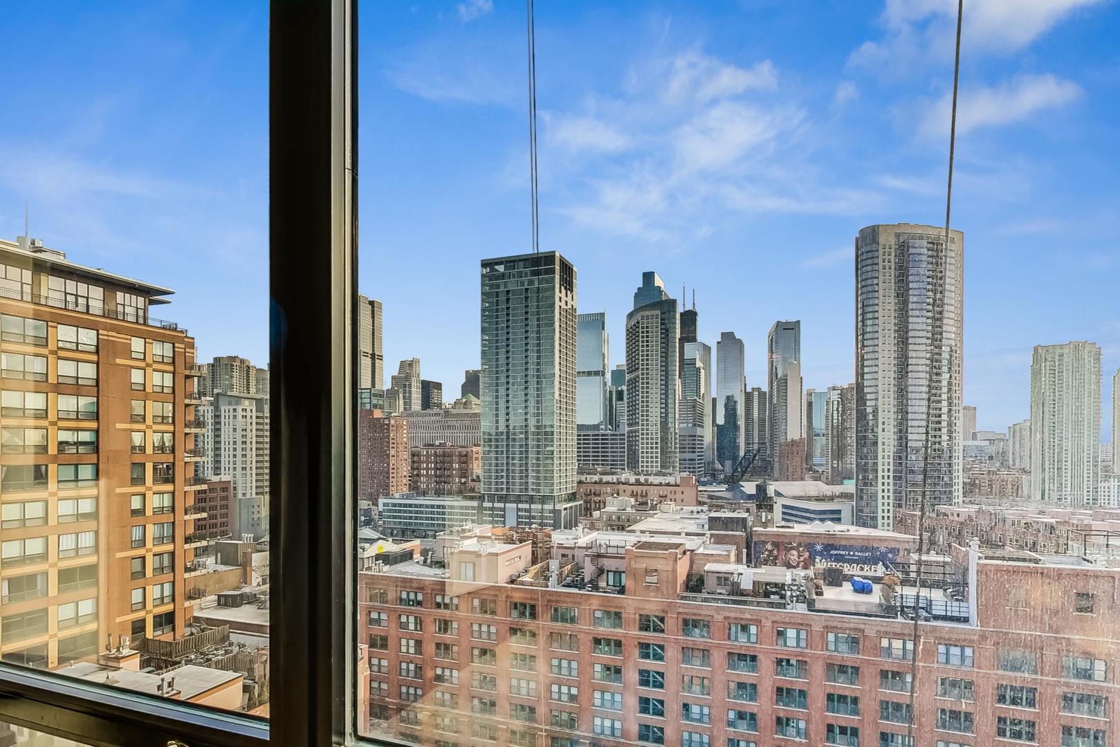 435 West Erie Street, Unit 1501 Chicago, IL 60654 - Photo 8 of 26 a view of a city with tall buildings