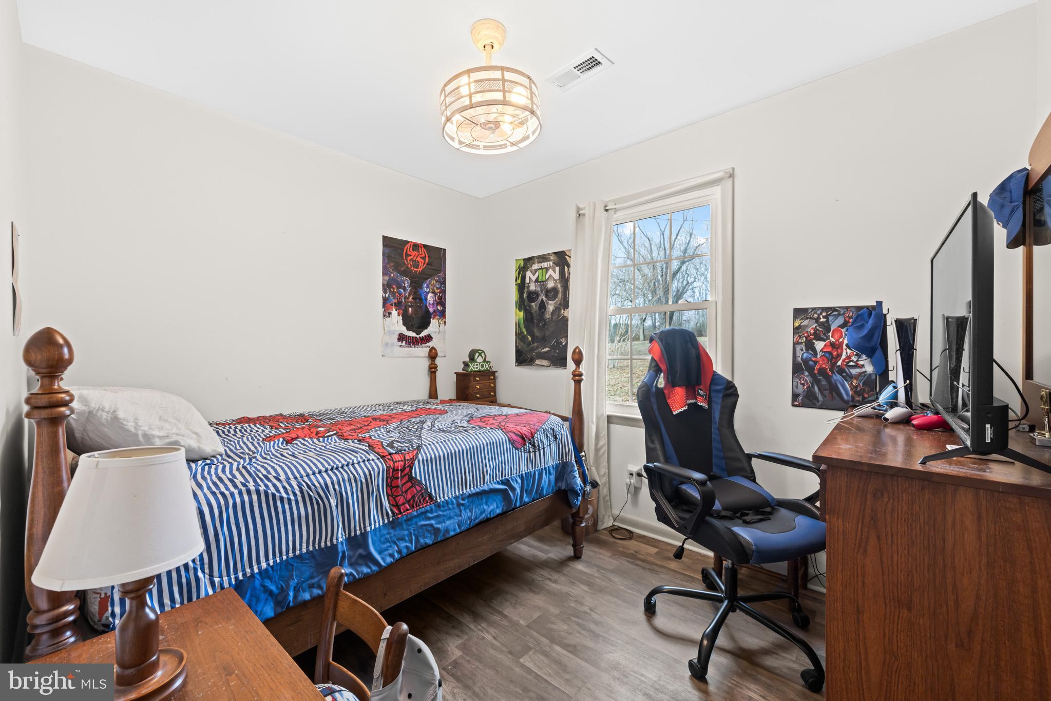 84 Clore Road Madison, VA 22727 - Photo 14 of 28 a bedroom with bed and a flat screen tv