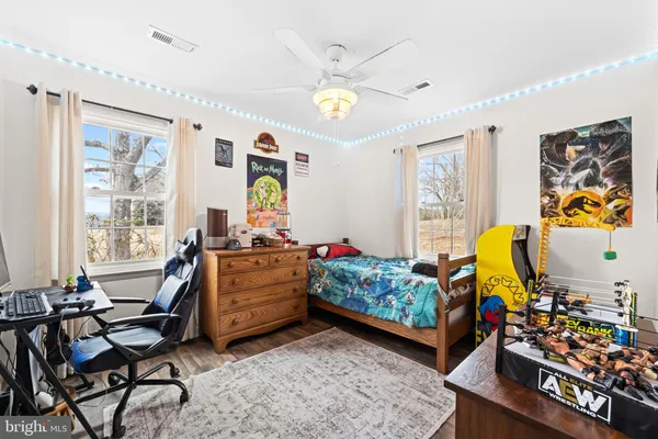 a bed room with furniture and a window
