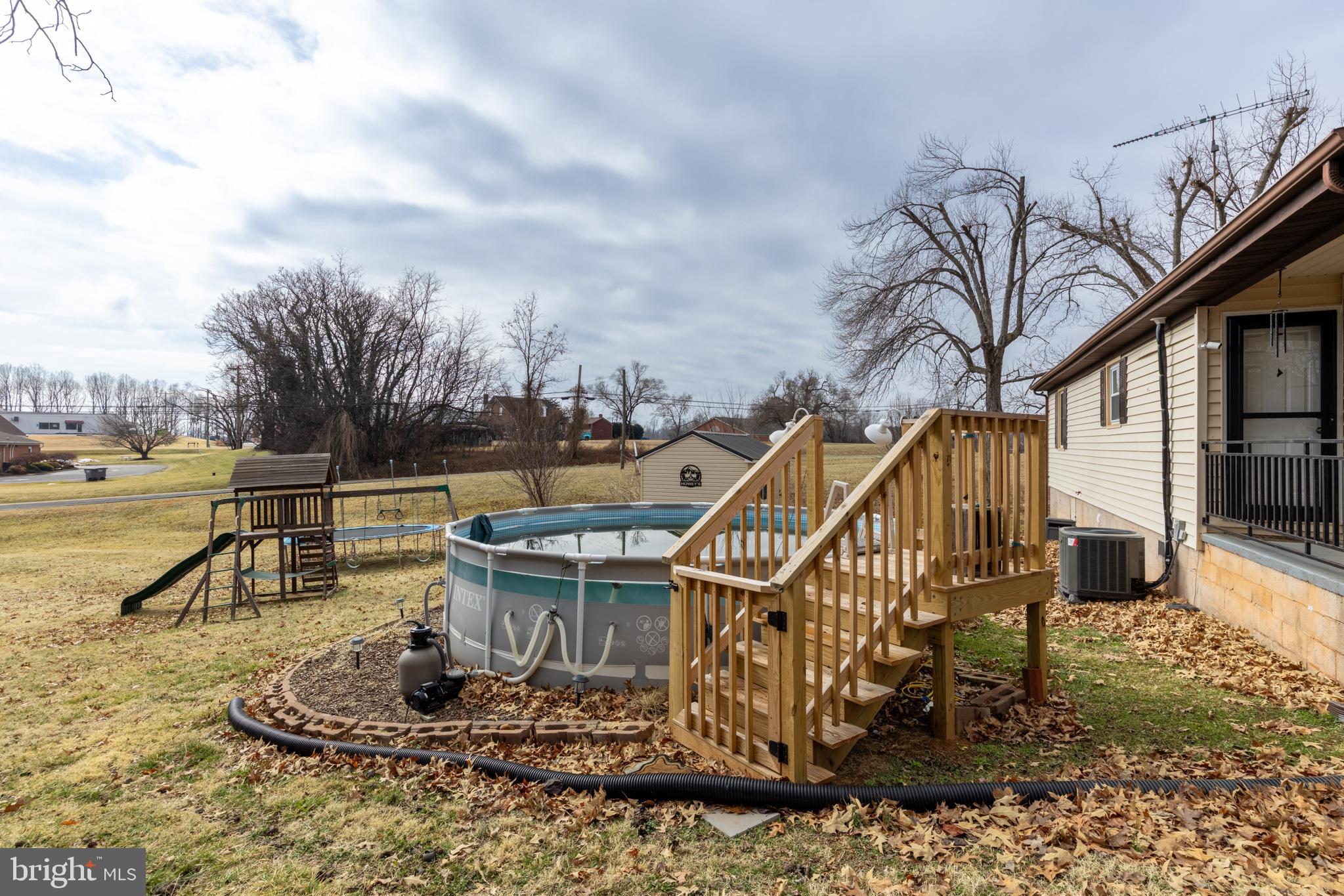 84 Clore Road Madison, VA 22727 - Photo 21 of 28 a view of a house with swimming pool and sitting area