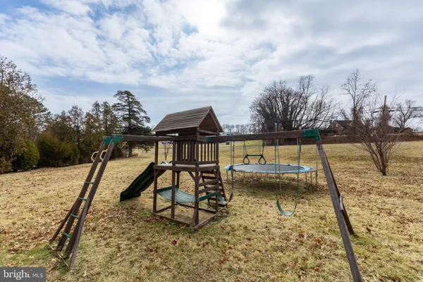 a view of a swimming pool with a lounge chair