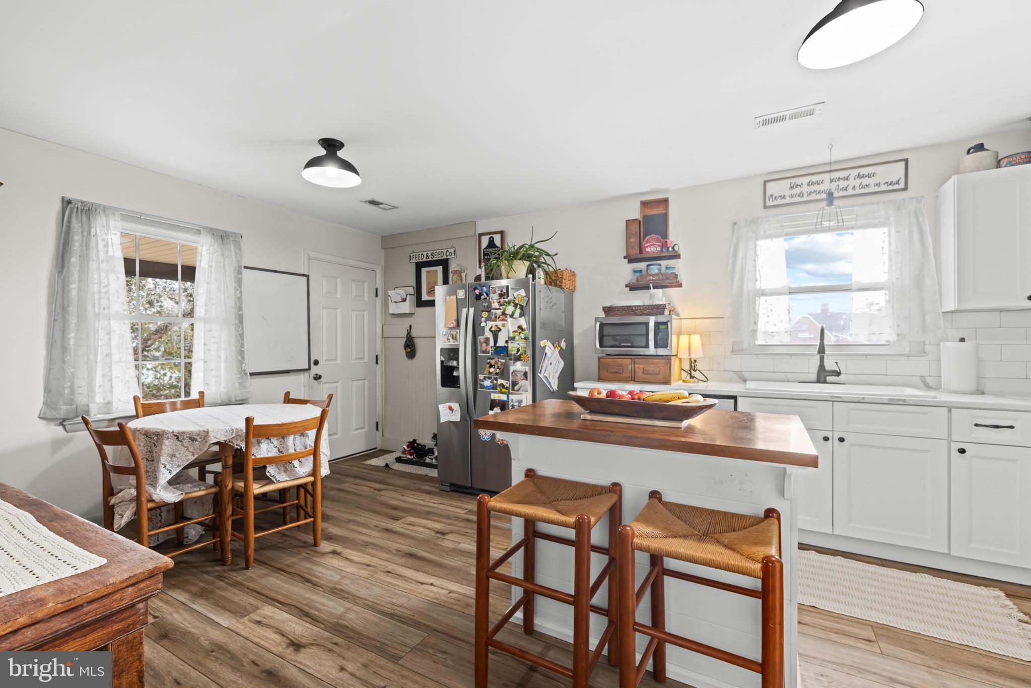84 Clore Road Madison, VA 22727 - Photo 7 of 28 a view of a dining room with furniture and wooden floor