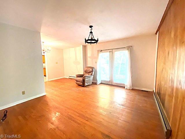 647 Hodgin Valley Road Pleasant Garden, NC 27313 - Photo 7 of 24 Den with hardwood floors. French doors leading onto backyard patio.