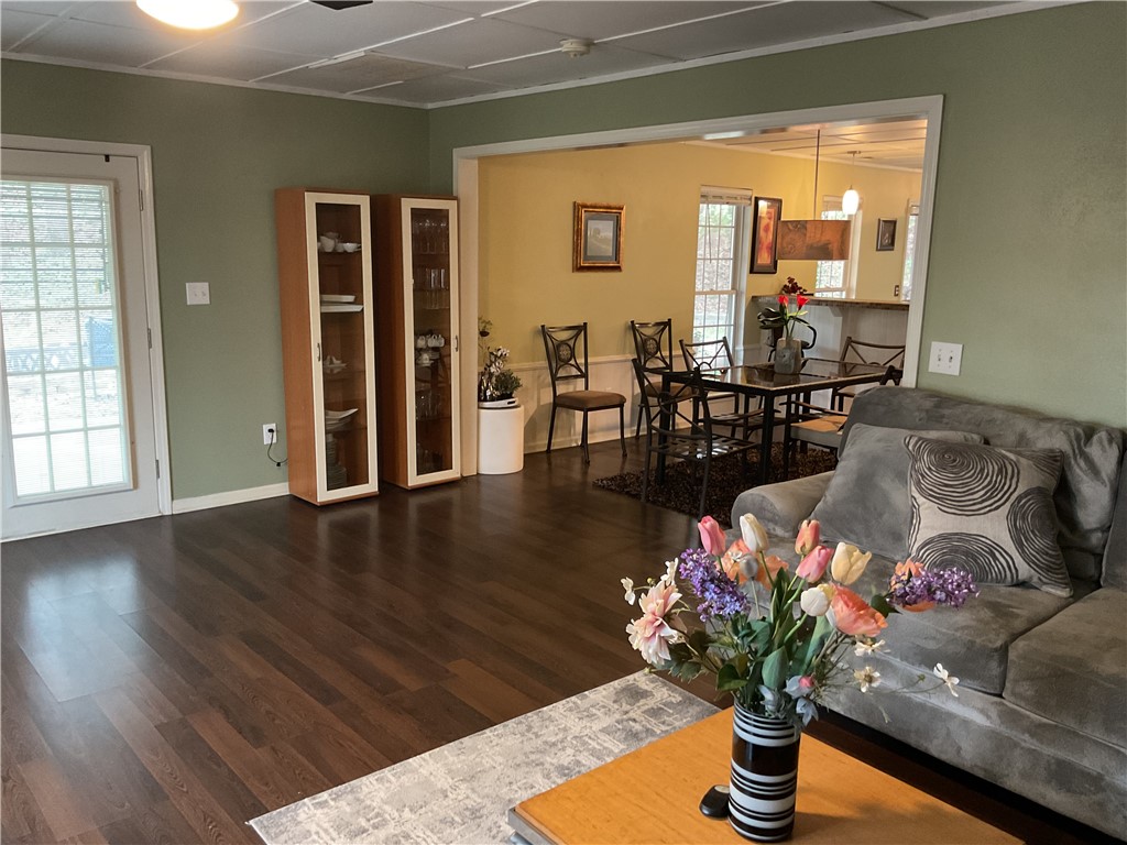229 Cub Cove Drive Walhalla, SC 29691 - Photo 7 of 50 This inviting space features rich hardwood flooring and a seamless transition to the dining area.