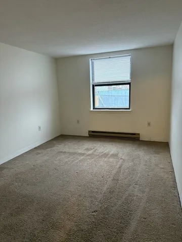 a view of a room that has a window