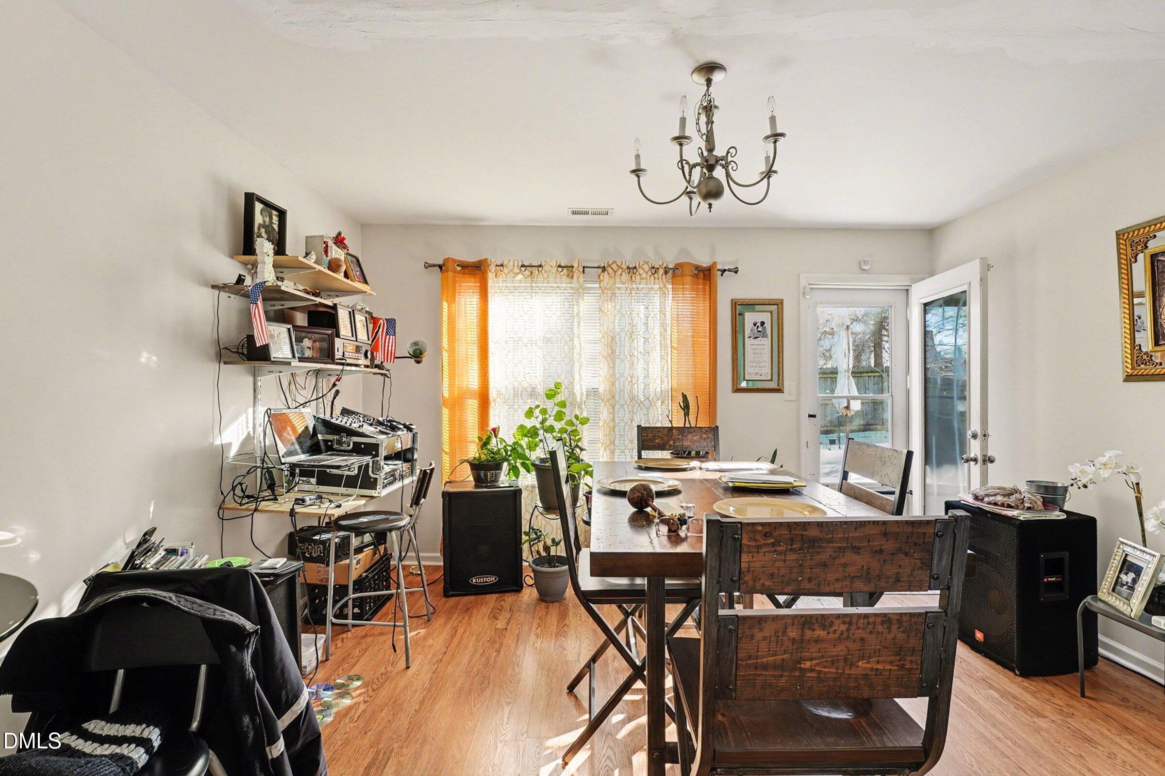1404 Ricochet Drive Raleigh, NC 27610 - Photo 10 of 31 a view of a dining room with furniture window and outside view