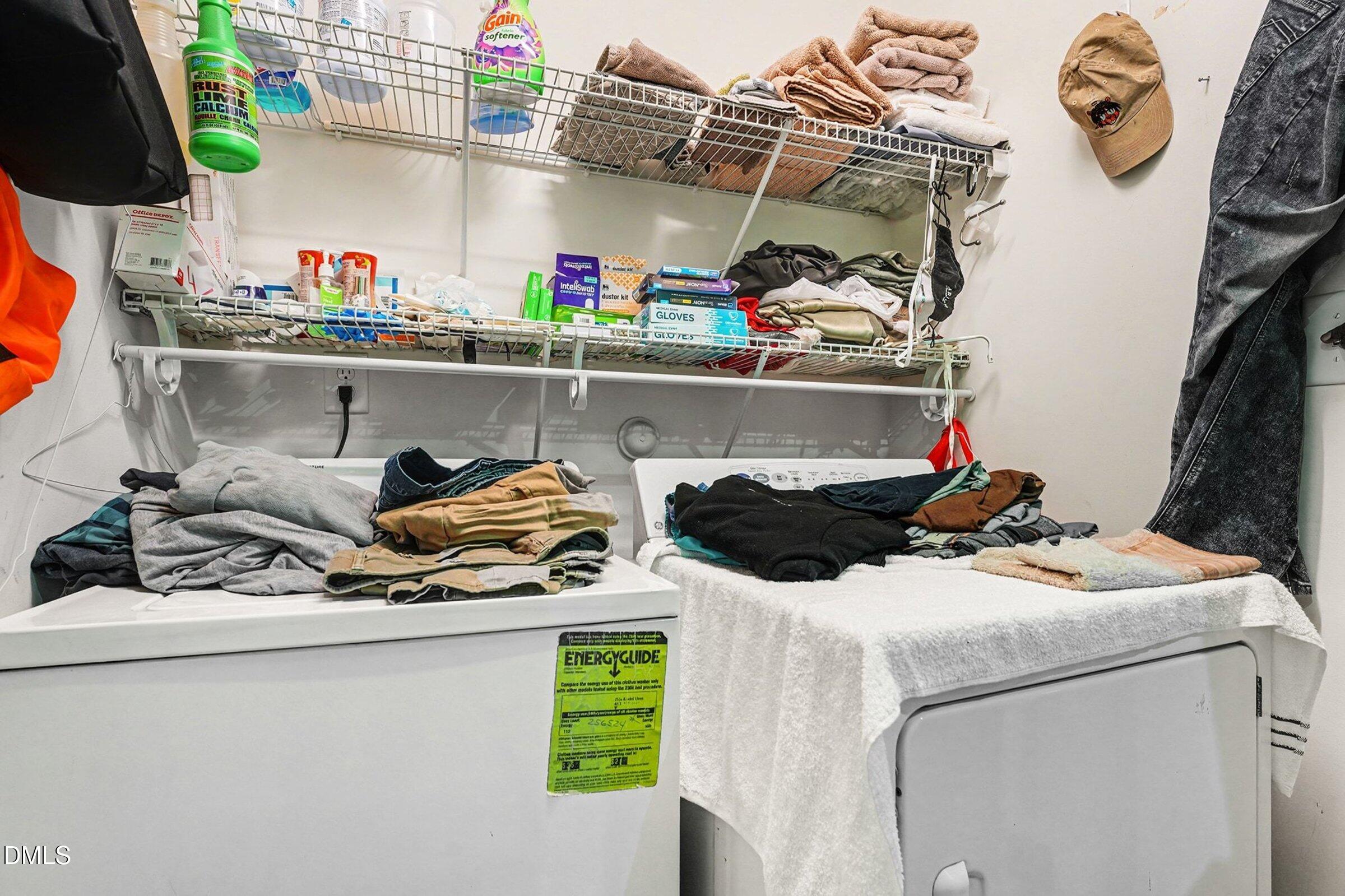 1404 Ricochet Drive Raleigh, NC 27610 - Photo 24 of 31 a utility room with sink dryer and washer