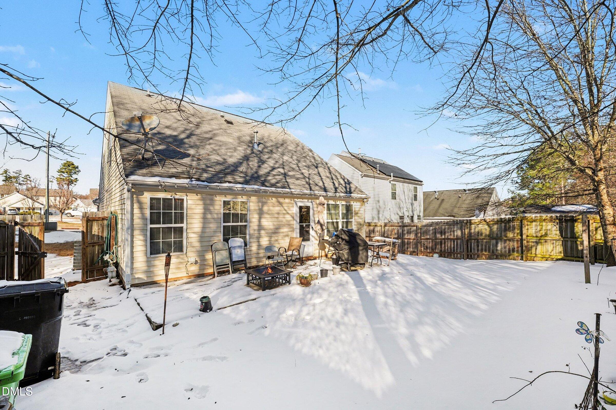 1404 Ricochet Drive Raleigh, NC 27610 - Photo 27 of 31 a view of a building with a snow on the road