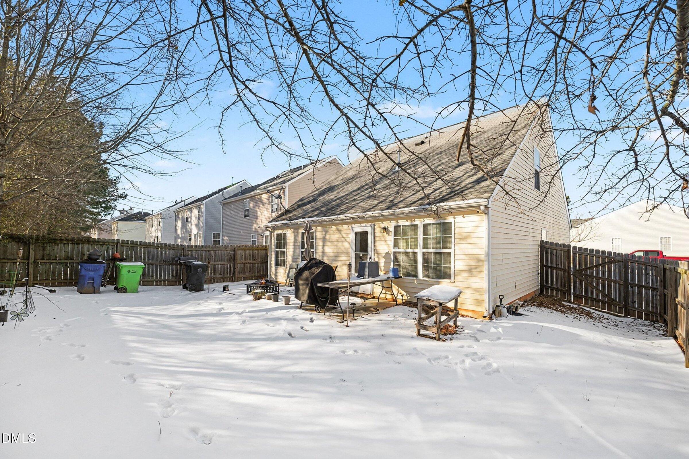 1404 Ricochet Drive Raleigh, NC 27610 - Photo 28 of 31 a view of a backyard with a patio