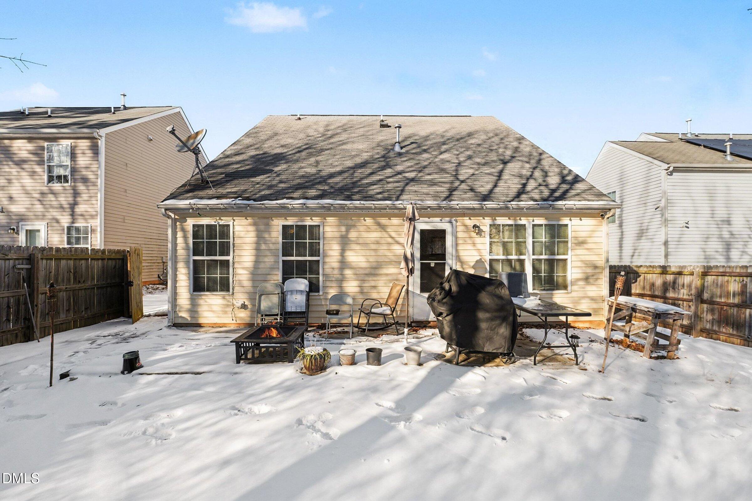 1404 Ricochet Drive Raleigh, NC 27610 - Photo 29 of 31 a building outdoor space with patio furniture and potted plants