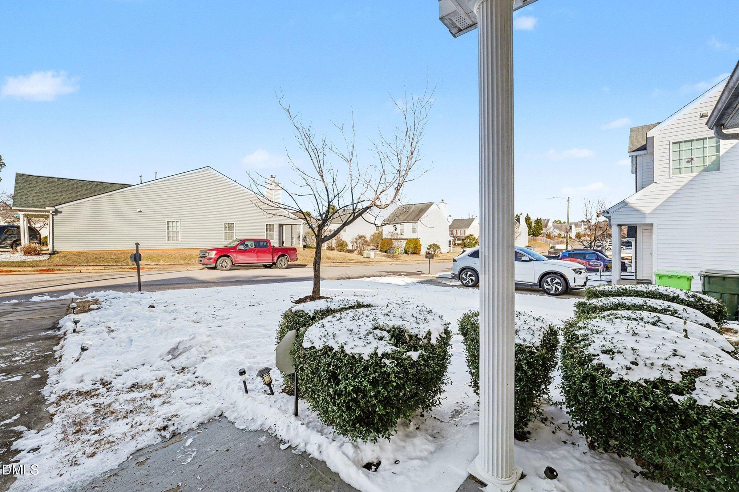 1404 Ricochet Drive Raleigh, NC 27610 - Photo 2 of 31 a view of road with large building