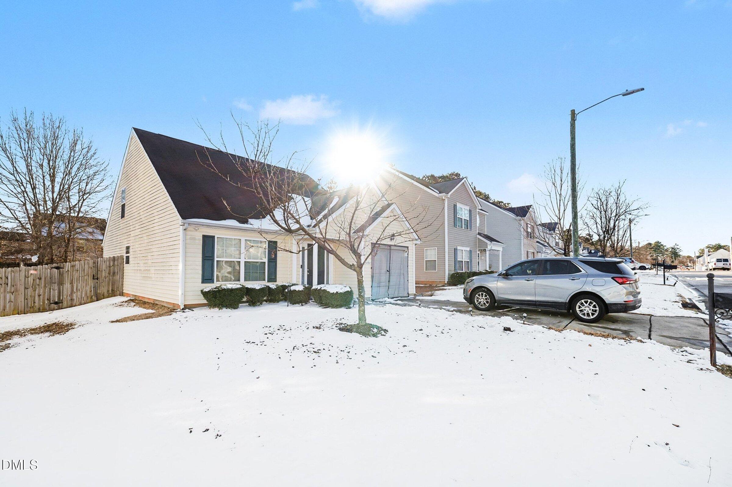 1404 Ricochet Drive Raleigh, NC 27610 - Photo 3 of 31 a view of a street with a building in the background