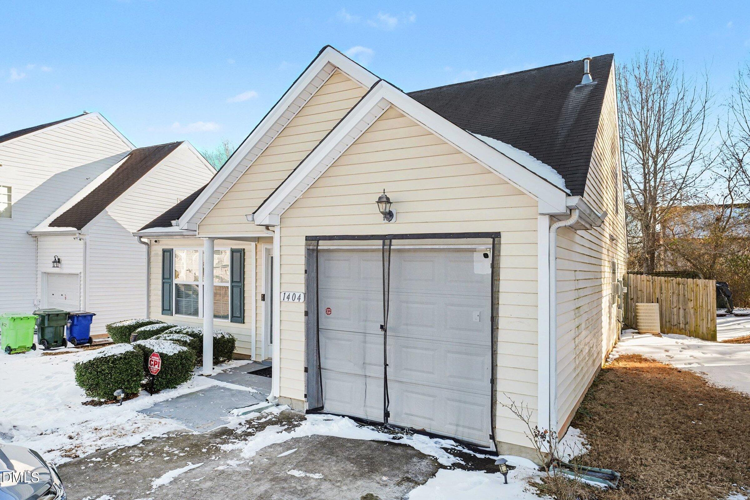 1404 Ricochet Drive Raleigh, NC 27610 - Photo 4 of 31 a view of a house with a outdoor space