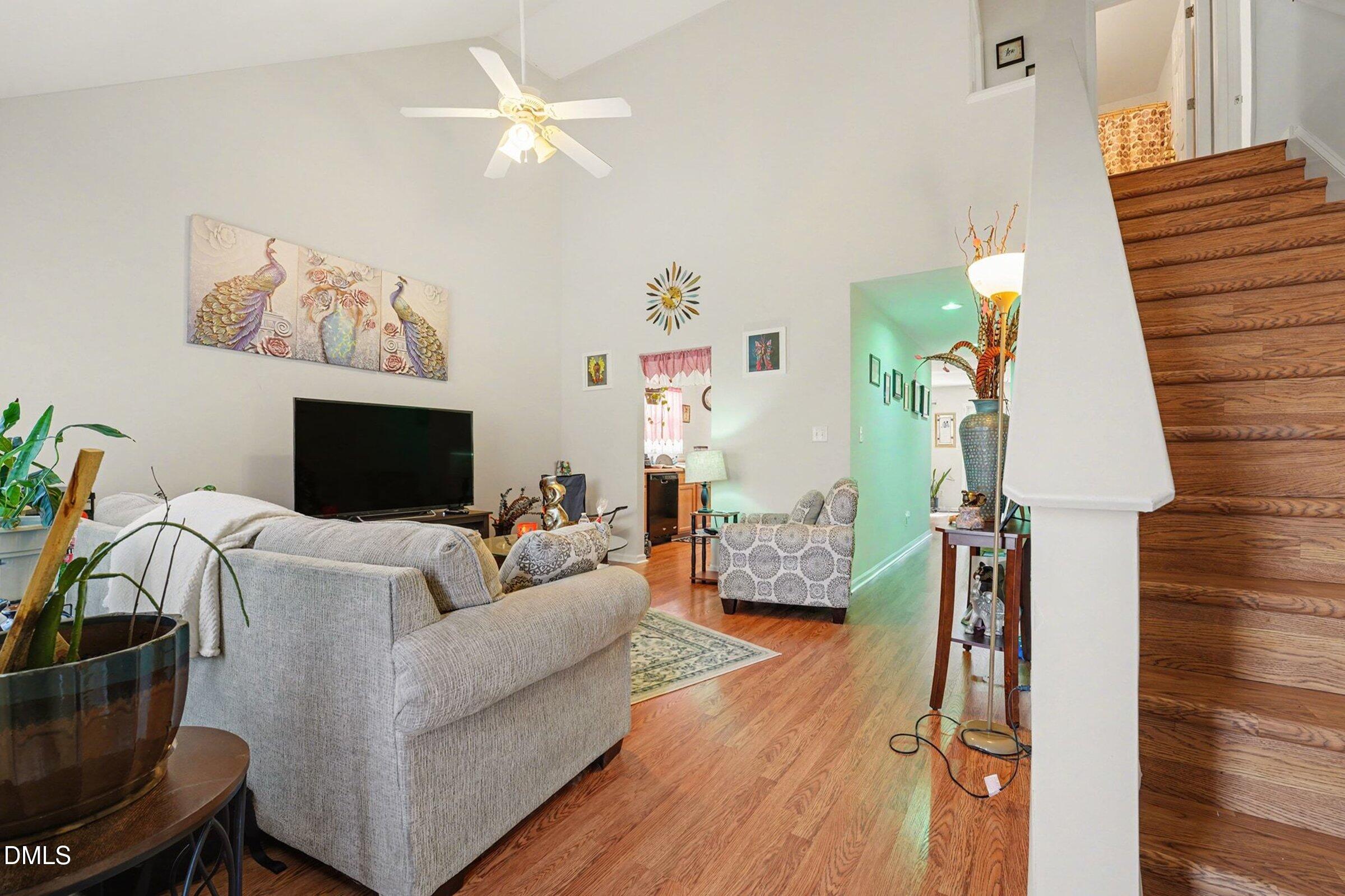 1404 Ricochet Drive Raleigh, NC 27610 - Photo 6 of 31 a living room with furniture and a flat screen tv