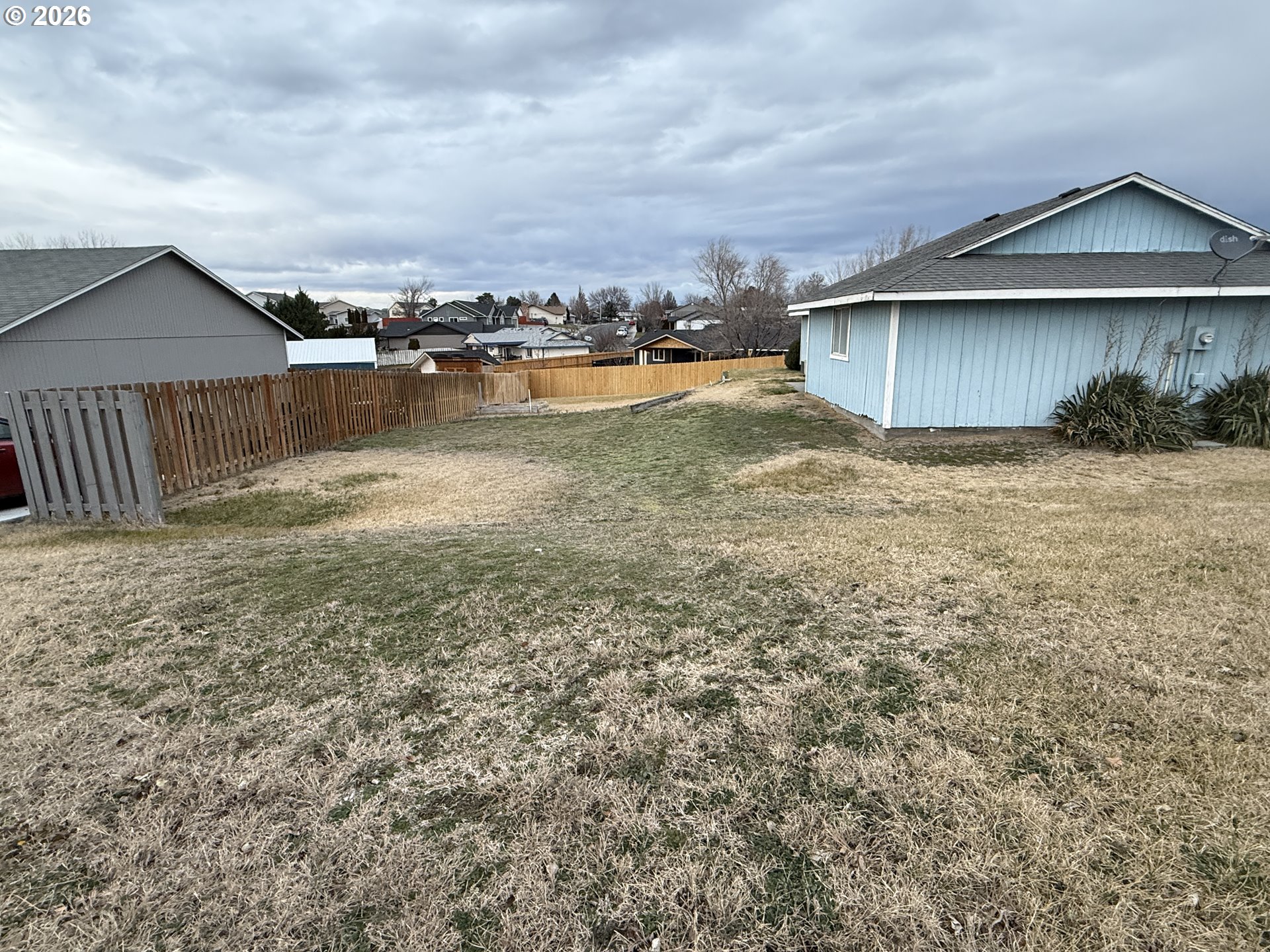 70 Northeast Alora Drive Hermiston, OR 97838 - Photo 3 of 14 a view of a house with a yard and sitting area