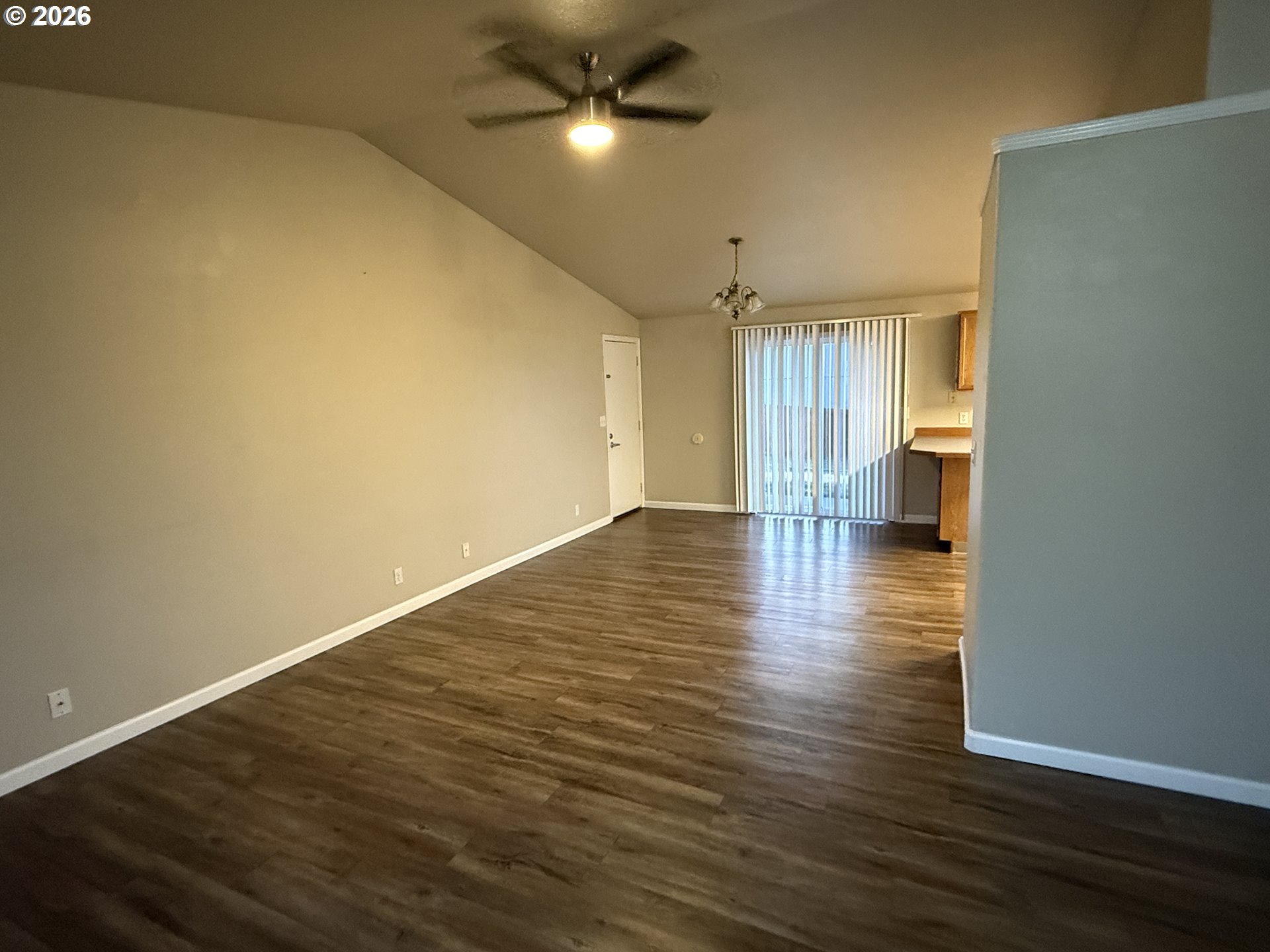 70 Northeast Alora Drive Hermiston, OR 97838 - Photo 7 of 14 a view of an empty room with a window and wooden floor