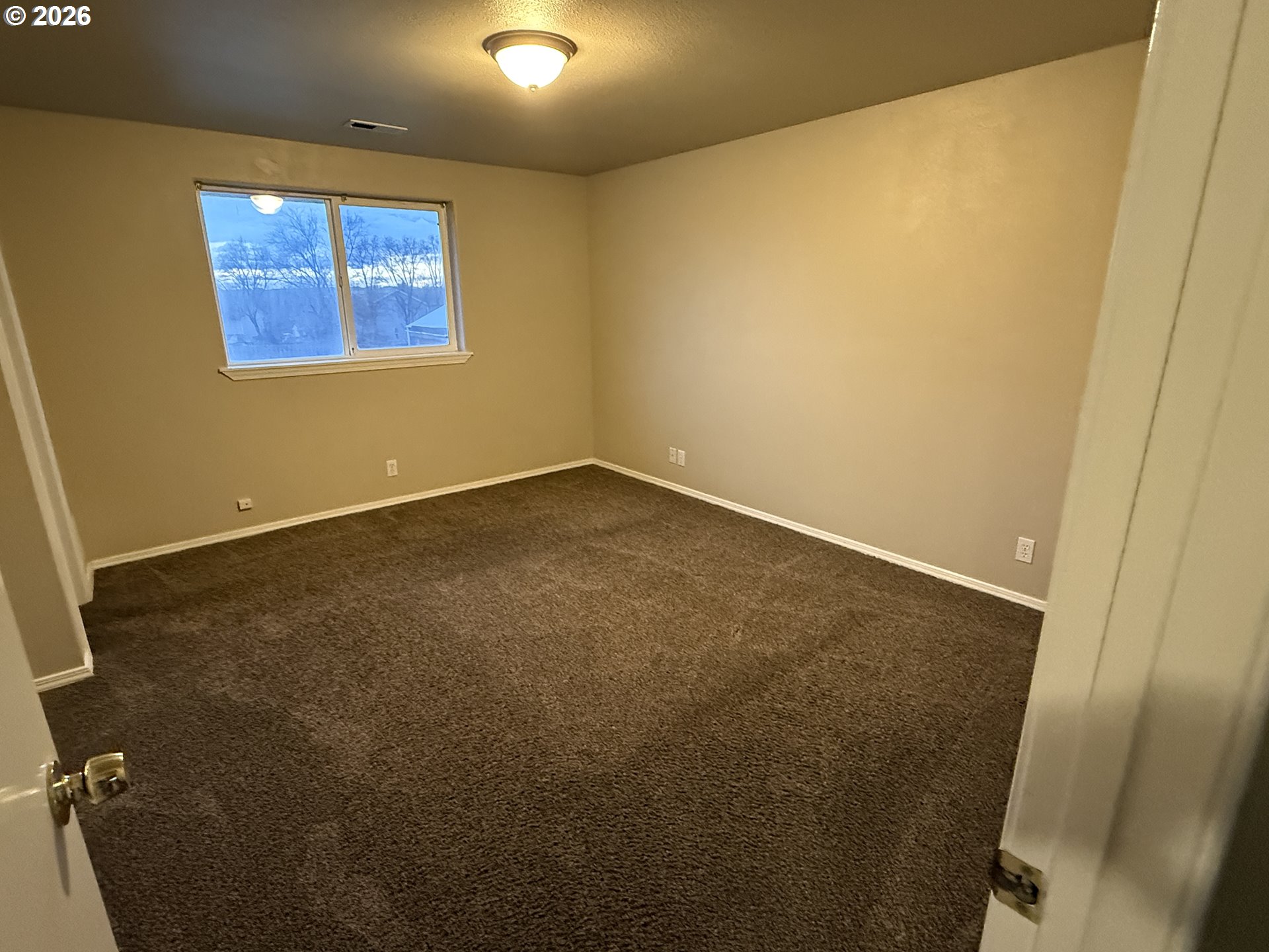 70 Northeast Alora Drive Hermiston, OR 97838 - Photo 8 of 14 an empty room with windows