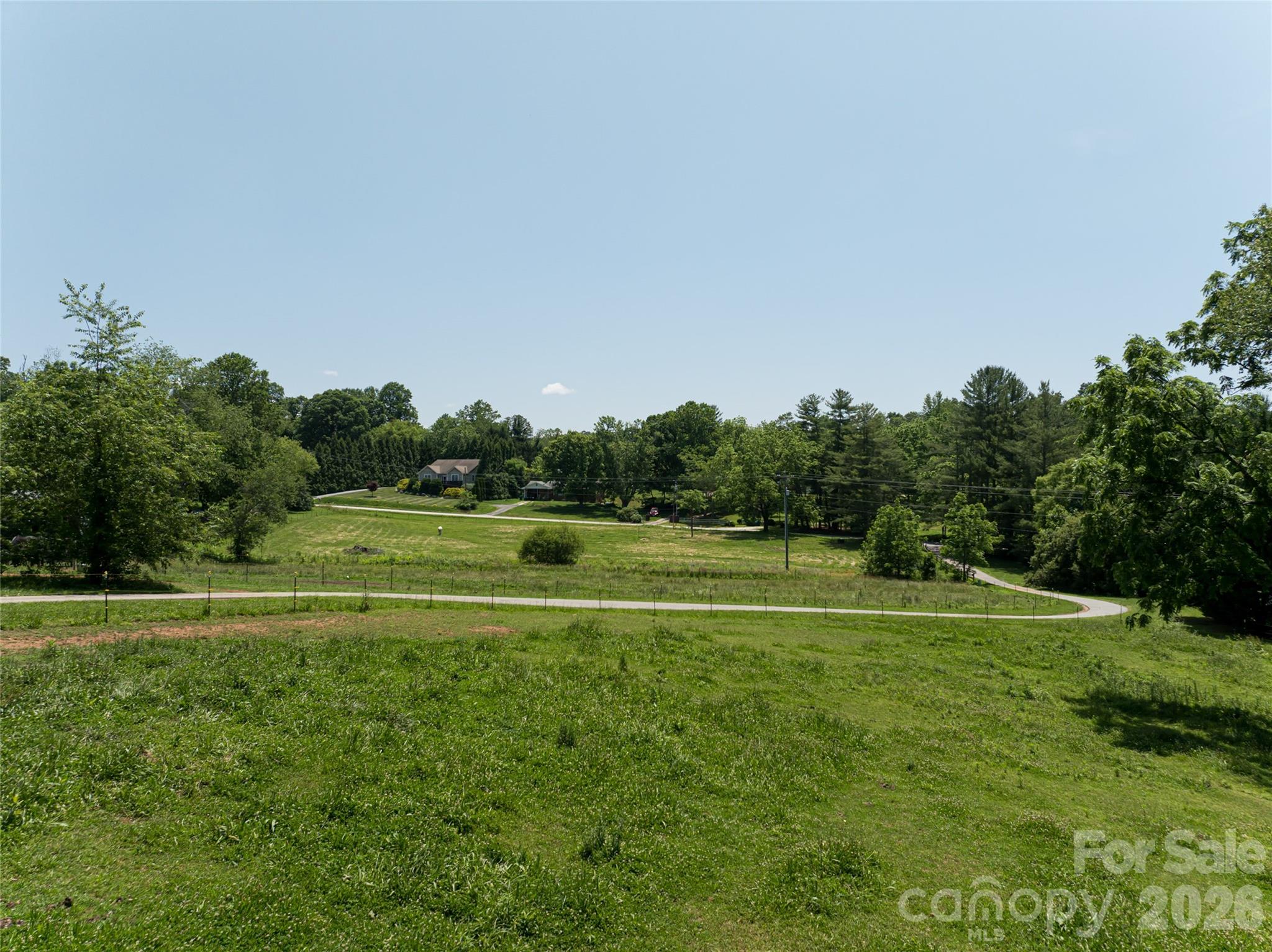 173 Avery Creek Road Arden, NC 28704 - Photo 17 of 35 a view of a golf course with a trees