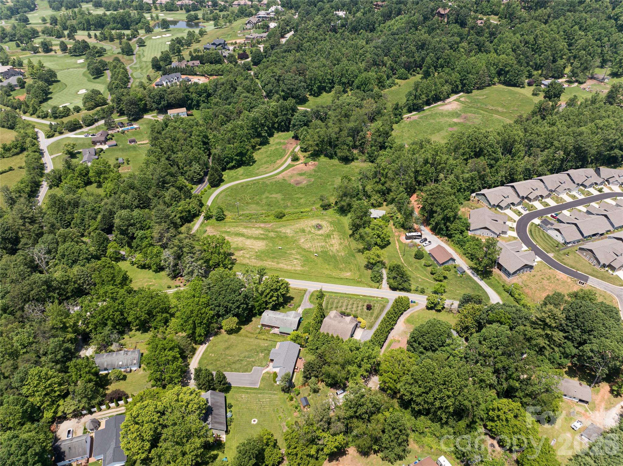173 Avery Creek Road Arden, NC 28704 - Photo 20 of 35 an aerial view of a house with a yard