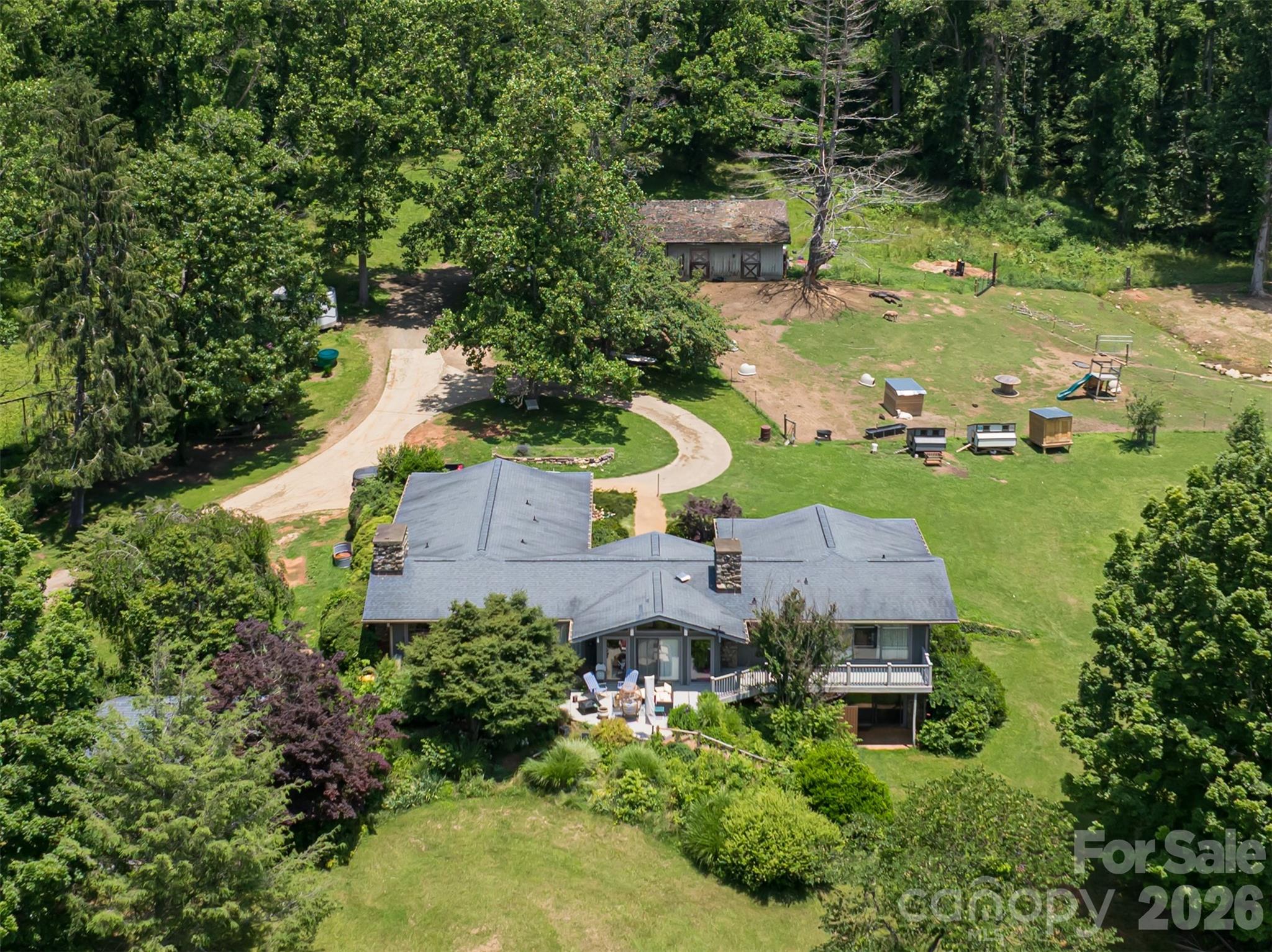 173 Avery Creek Road Arden, NC 28704 - Photo 23 of 35 an aerial view of a house with a yard