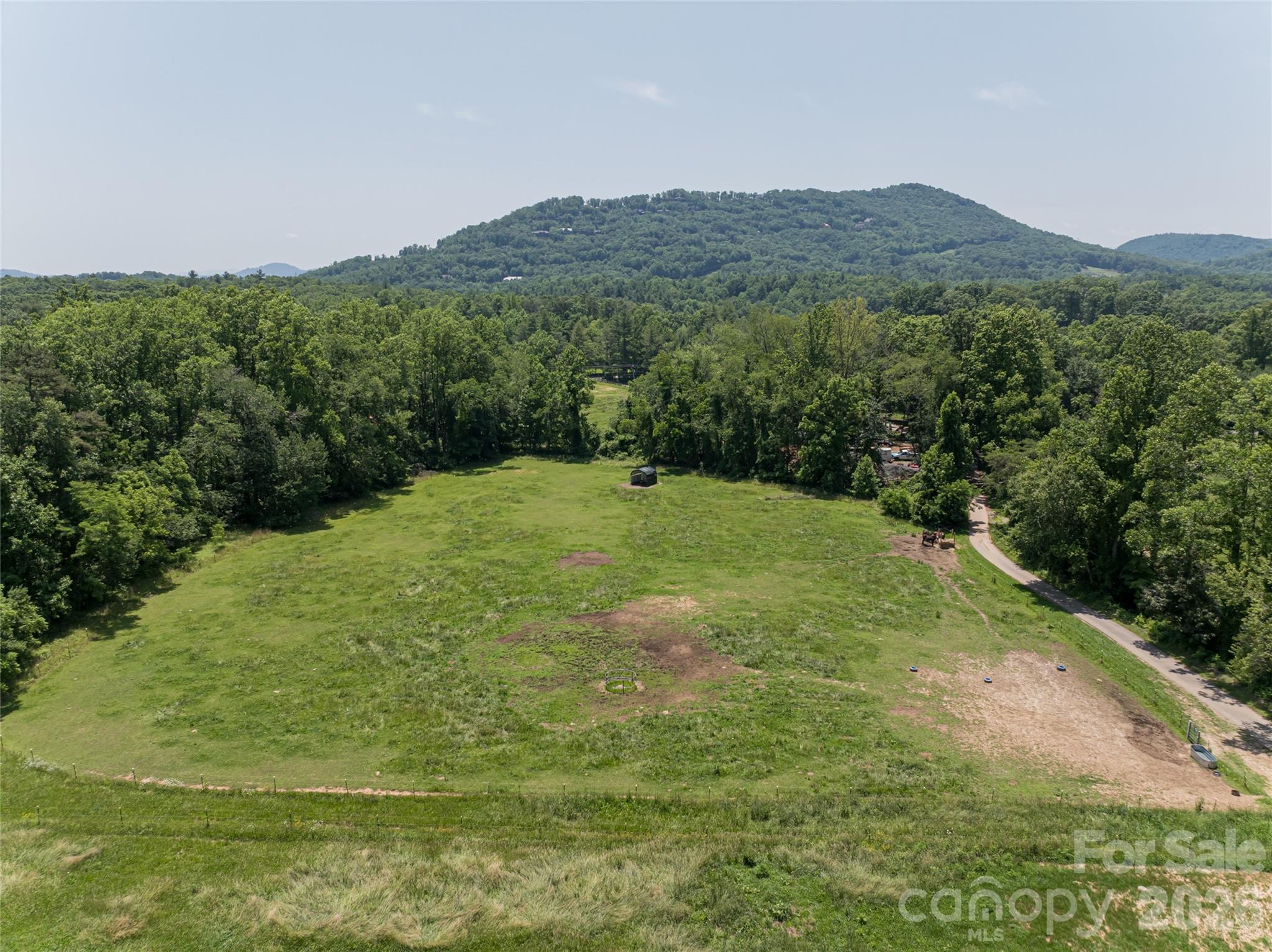 173 Avery Creek Road Arden, NC 28704 - Photo 26 of 35 a view of an outdoor space and a yard