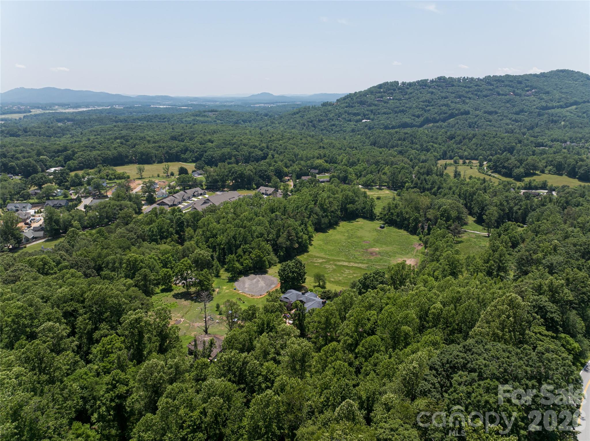 173 Avery Creek Road Arden, NC 28704 - Photo 30 of 35 an aerial view of a house with mountain view