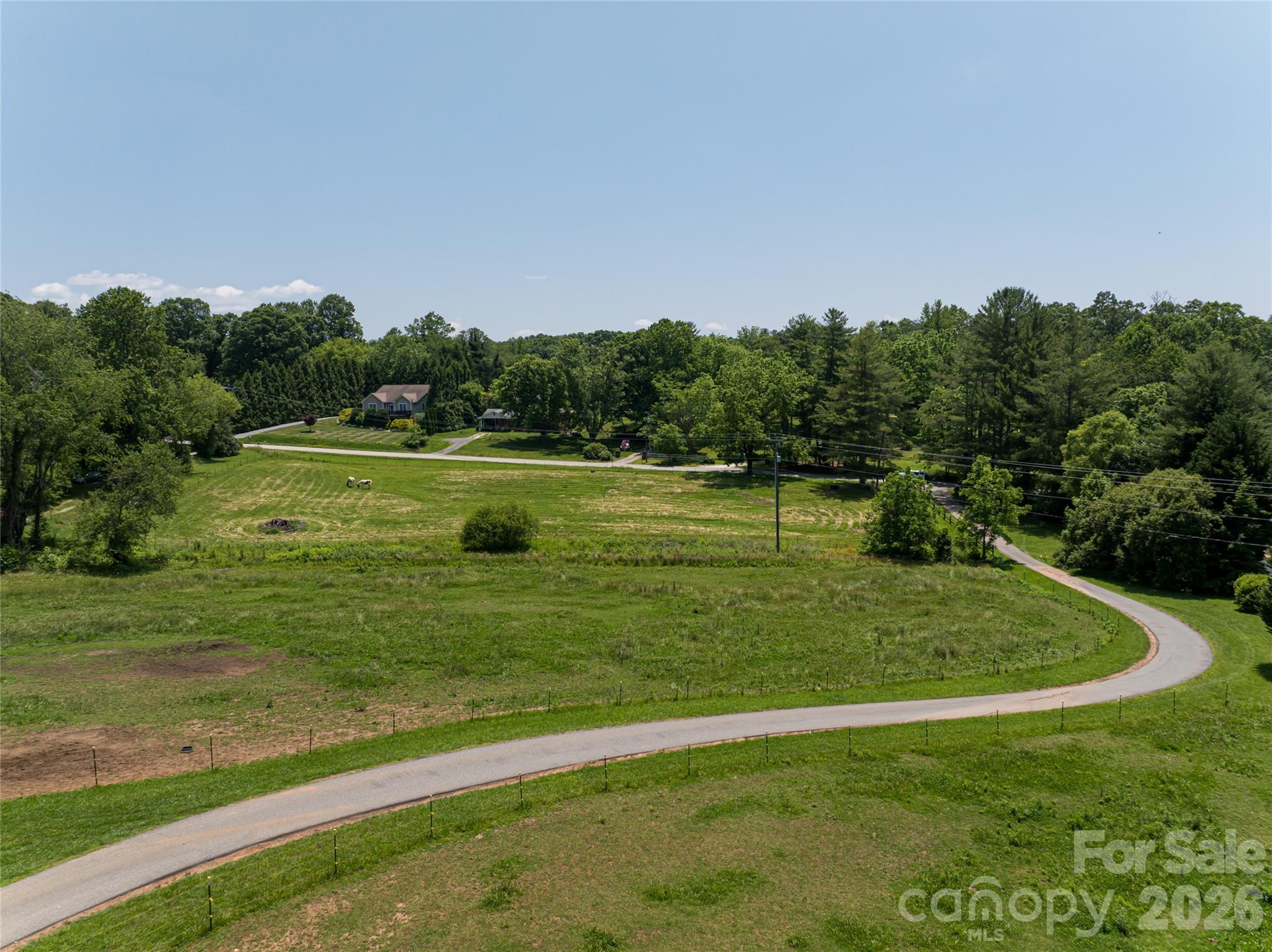 173 Avery Creek Road Arden, NC 28704 - Photo 32 of 35 a view of a big yard with swimming pool and green space