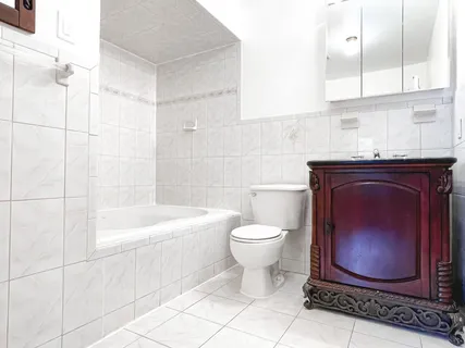 a bathroom with a toilet a sink and bathtub