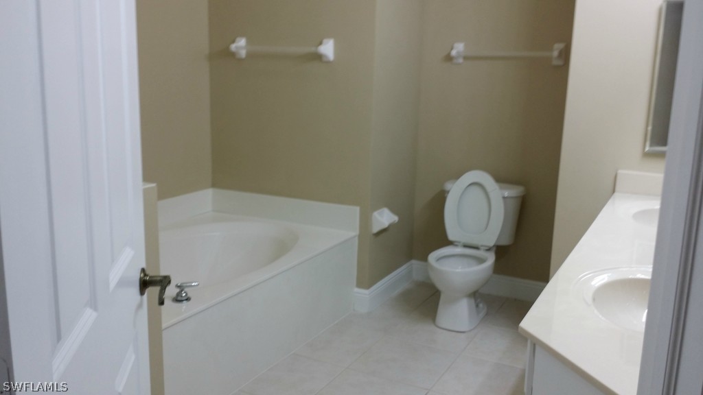 2743 First Street, Unit 305 Fort Myers, FL 33916 - Photo 11 of 21 a bathroom with a toilet and a sink