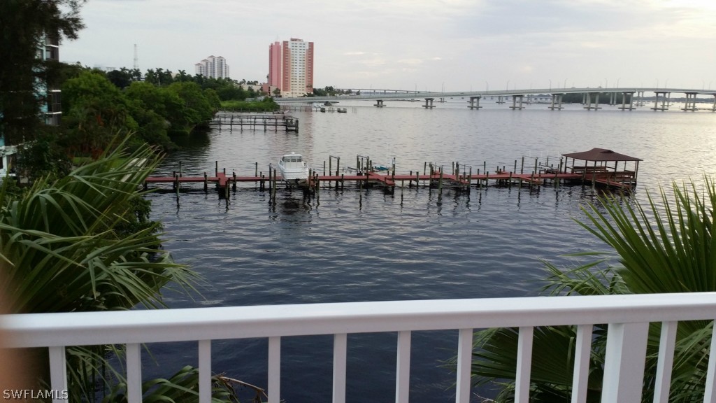 2743 First Street, Unit 305 Fort Myers, FL 33916 - Photo 13 of 21 a view of a lake with boats and palm trees
