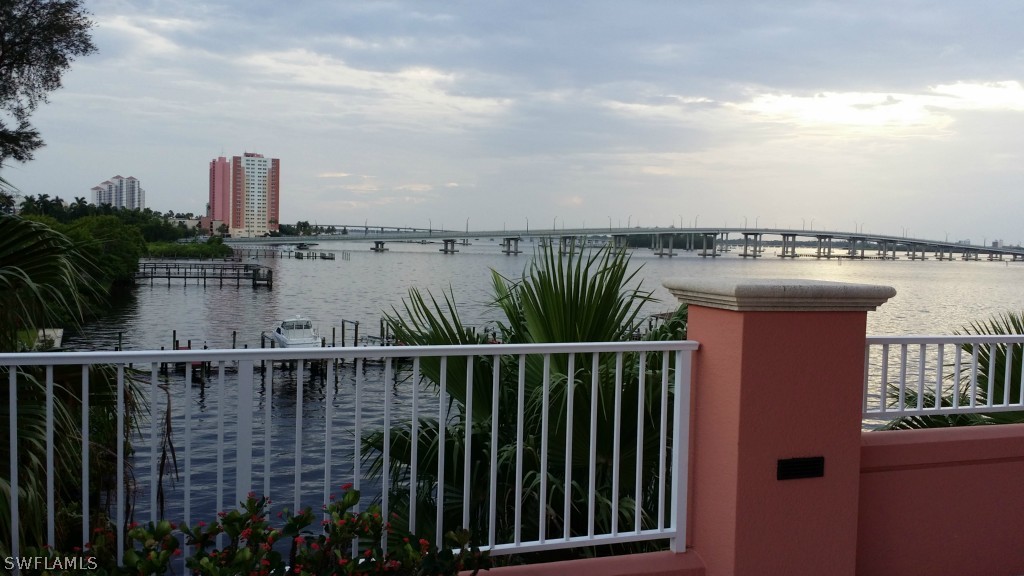 2743 First Street, Unit 305 Fort Myers, FL 33916 - Photo 15 of 21 a view of a balcony with wooden floor and lake view