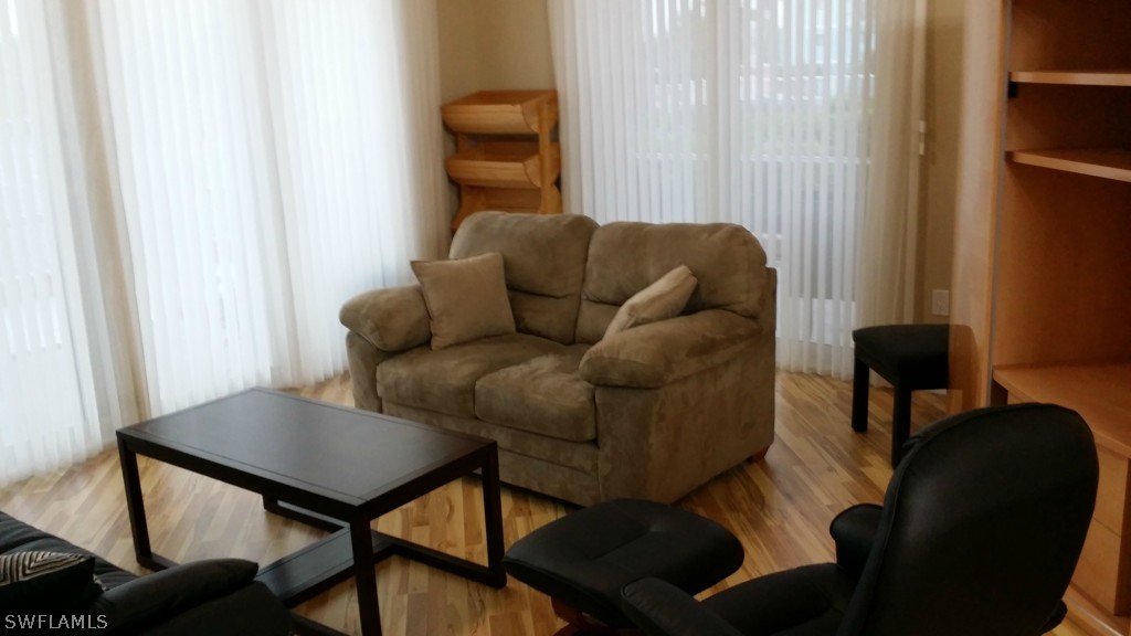 2743 First Street, Unit 305 Fort Myers, FL 33916 - Photo 5 of 21 a view of a livingroom with furniture and a window