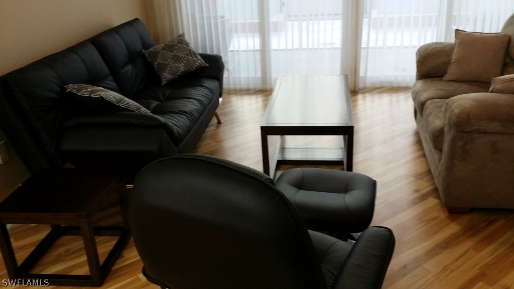 2743 First Street, Unit 305 Fort Myers, FL 33916 - Photo 6 of 21 a living room with furniture and a window