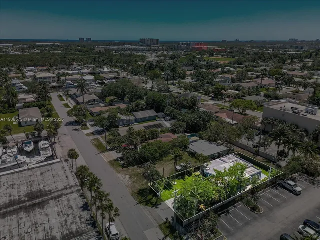 an aerial view of a residential houses with outdoor space