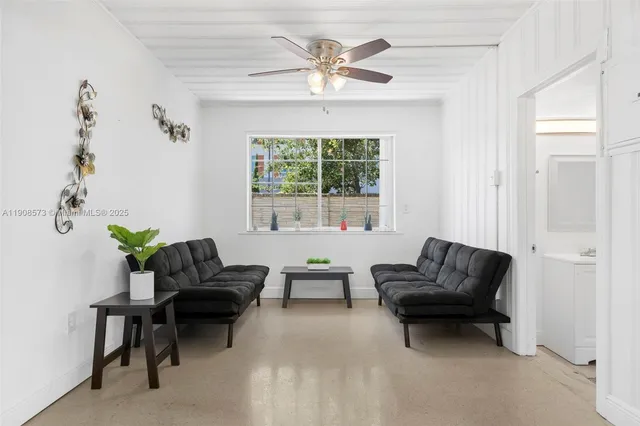 a living room with furniture and a window