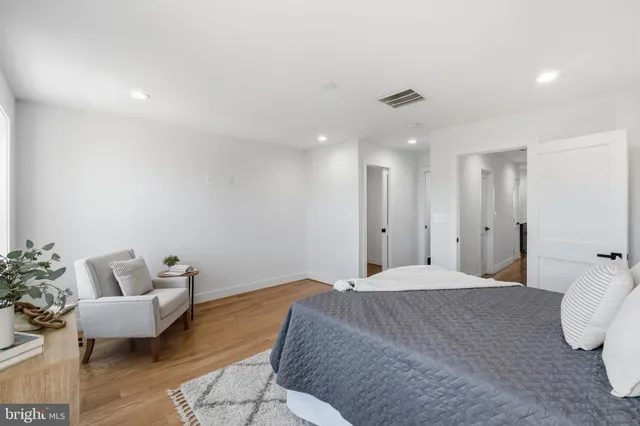 a bedroom with a bed and a couch