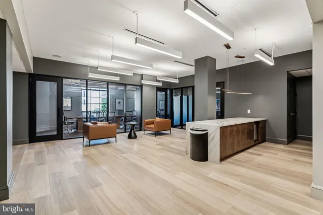 a view of a patio with couple of chairs and a fountain