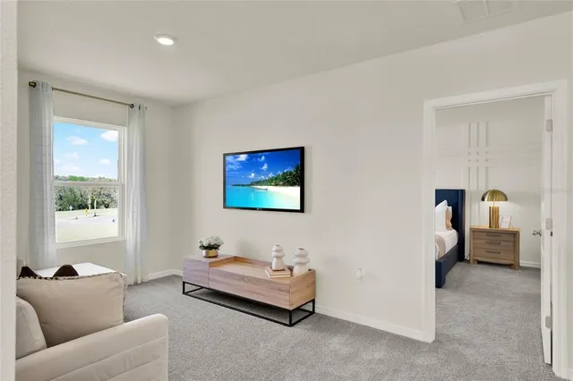 a living room with furniture and a window