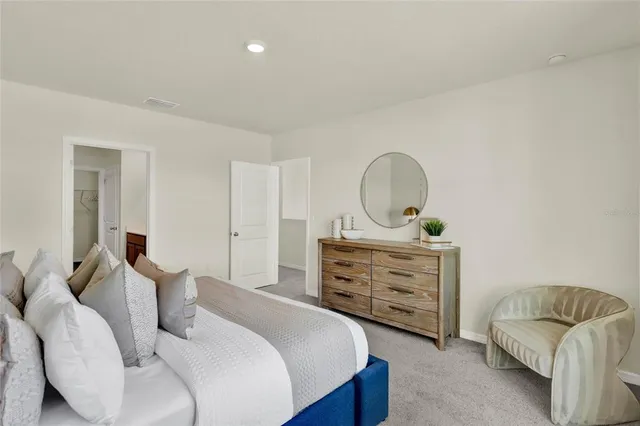 a bedroom with a bed and furniture