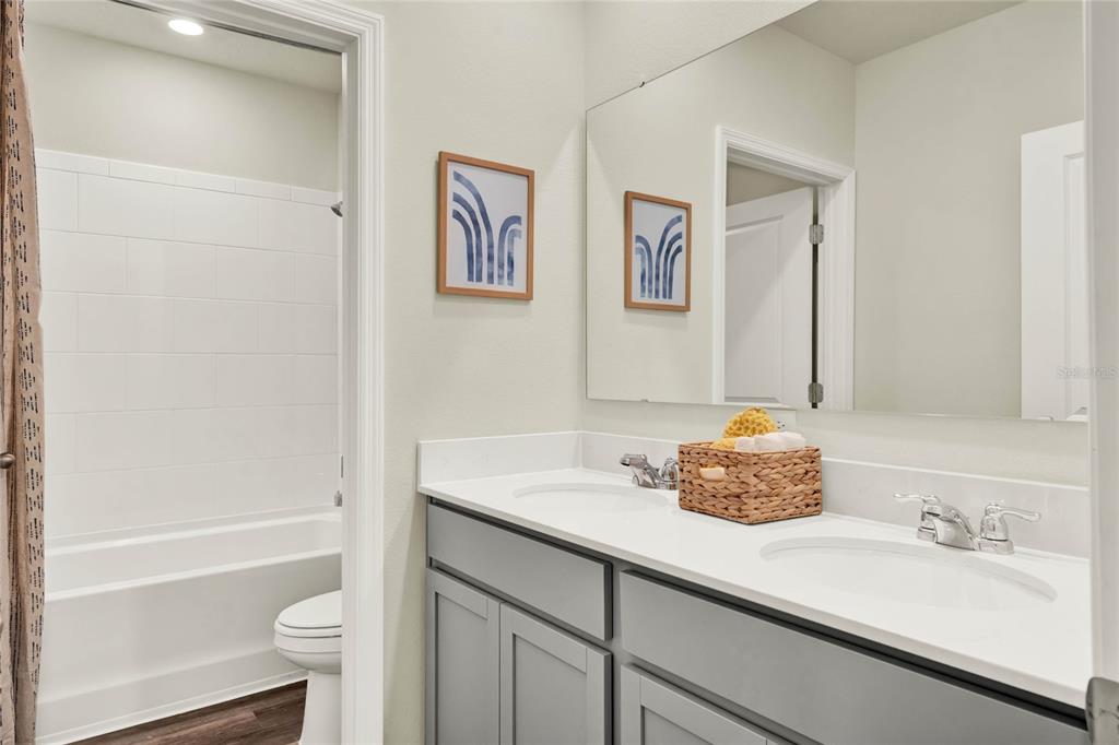 5259 Nickerbean Street Apopka, FL 32712 - Photo 30 of 33 a bathroom with a sink a toilet and shower