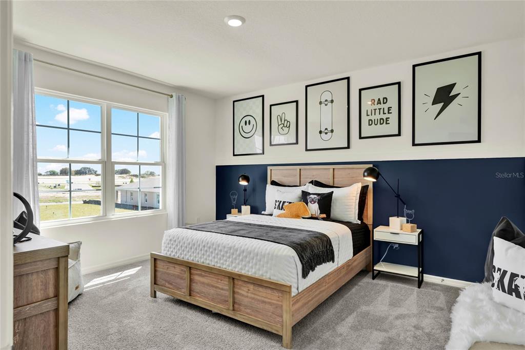 5259 Nickerbean Street Apopka, FL 32712 - Photo 31 of 33 a bedroom with a bed painting on wall and a large window